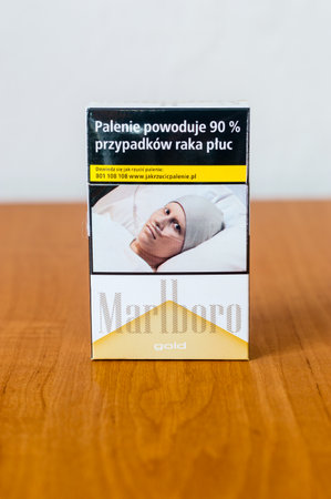 Deblin, Poland - September 30, 2018: Marlboro Gold cigarettes pack on wooden table.のeditorial素材
