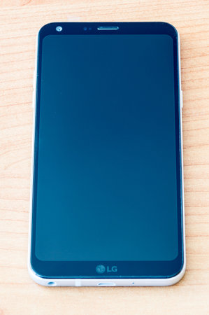 Pruszcz Gdanski, Poland - October 13, 2018: LG Q6 mobile phone on wooden table.