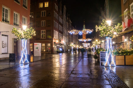 Gdansk, Poland - December 25, 2018: Long street with Christmas decoration in the old town of Gdansk at night.のeditorial素材