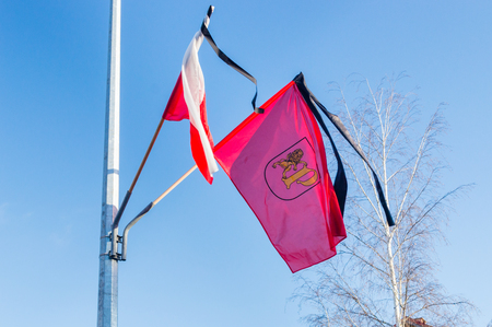 Pruszcz Gdanski and Polish flags with black ribbon.の写真素材