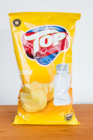 Pruszcz Gdanski, Poland - January 21, 2019: Bag of salted Top chips on wooden table.