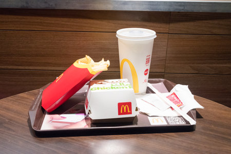 Aqaba, Jordan - February 7, 2019: McDonald Chicken Mac menu with french fries and Coca-Cola.