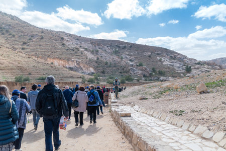 Petra, Jordan - February 8, 2019: Tourists on pathway at Petra. Petra is one of the New Seven Wonders of the World.のeditorial素材
