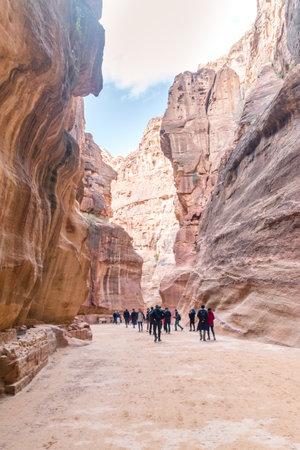 Petra, Jordan - February 8, 2019: al-Siq with tourists in Petra, Jordan. Siq is the main entrance to the ancient Nabatean city of Petra in southern Jordan.のeditorial素材