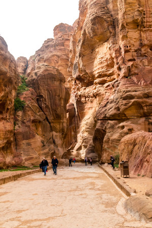 Petra, Jordan - February 8, 2019: Valley between rocks in the city of Petra, Jordan. Petra is a historical and archaeological city in southern Jordan.のeditorial素材