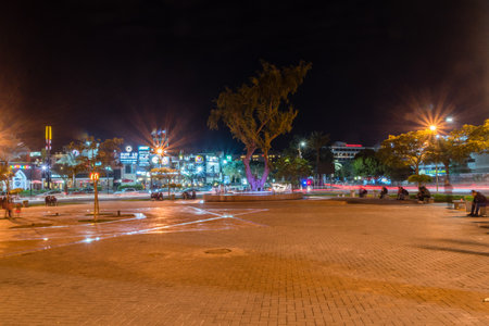Aqaba, Jordan - February 8, 2019: Square at Great Arab Revolt Circle at night.のeditorial素材