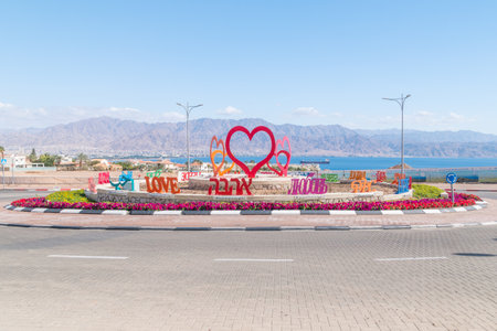 Eilat, Israel - February 9, 2019: Love roundabout in Eilat. Roundabout and Aqaba gulf in background.のeditorial素材