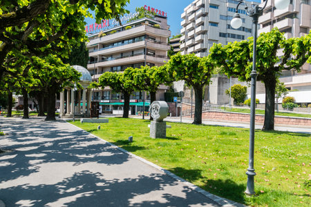 Lugano, Switzerland - June 1, 2019: Pedestrian alley with arts near the lake Lugano (Lago di Lugano).のeditorial素材
