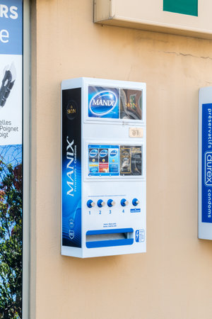 Orange, France - June 4, 2019: Condom machine with Manix and Skyn condoms.
