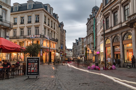 Brussels, Belgium - June 5, 2019: Beautiful street Marche Aux Herbes in the evening.のeditorial素材