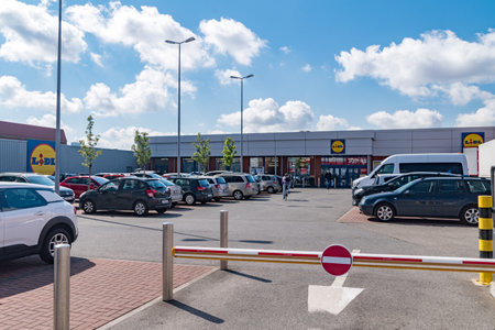 Brussels, Belgium - June 6, 2019: Lidl supermarket with cars parked outside.のeditorial素材