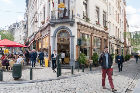 Brussels, Belgium - June 6, 2019: Corner of the building with Chez Papy Resto Snack restaurant with belgian frites.のeditorial素材