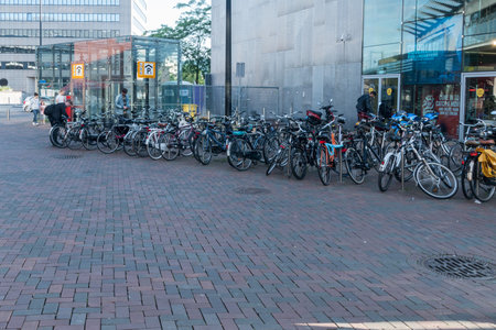 Amsterdam, Netherlands - June 6, 2019: Row of parked bicycles at Amsterdam Bijlmer ArenA railway station.のeditorial素材