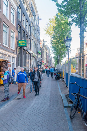 Amsterdam, Netherlands - June 6, 2019: View of the Oudezijds Achterburgwal street in the old town.のeditorial素材