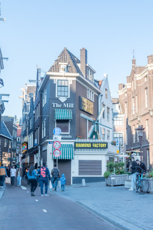 Amsterdam, Netherlands - June 6, 2019: View of Langebrugsteeg street with The Mill Diamond store in Amsterdam.のeditorial素材