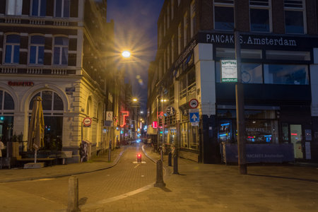 Amsterdam, Netherlands - June 6, 2019: Night view of small alley in old town of Amsterdam.のeditorial素材