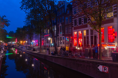 Amsterdam, Netherlands-June 6, 2019: Canal of the Red Light District in Amsterdam at night.のeditorial素材