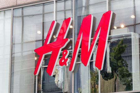 Hanover, Germany - June 8, 2019: Close-up of H&M logo. H & M Hennes & Mauritz AB is a Swedish multinational retail-clothing company.のeditorial素材
