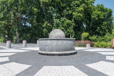 Garbatka-Letnisko, Poland - June 30, 2019: Fountain with a stone ball floating on the water at square of Major WÅadyslaw Szymanowski.のeditorial素材