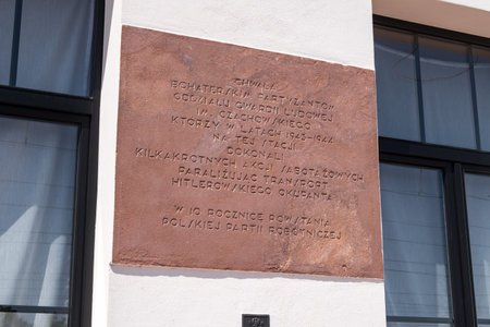 Garbatka-Letnisko, Poland - June 30, 2019: Plaque commemorating partisans of the Czachowski People's Guard unit at Garbatka railway station.のeditorial素材