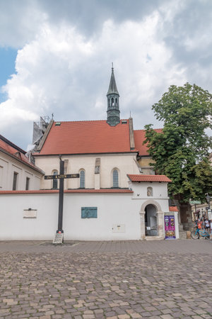 Krakow, Poland - July 26, 2019: Katyn Monument with Church of St. Giles in background.のeditorial素材