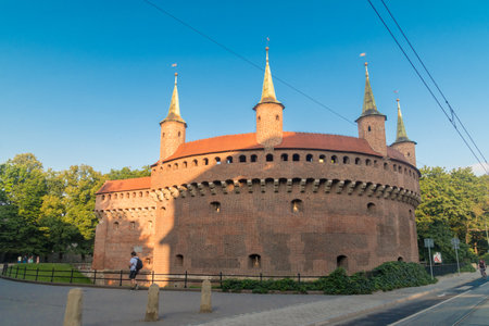 Krakow, Poland - July 27, 2019: Cracow Barbican (Polish: Barbakan Krakowski) in the morning. Barbican â a fortified outpost once connected to the city walls.のeditorial素材