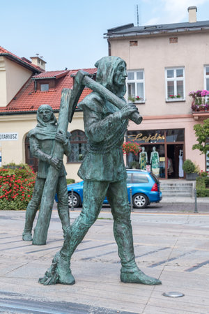Wieliczka, Poland - July 27, 2019: One of workers at monument of medieval salt mine worker at the main market square.のeditorial素材