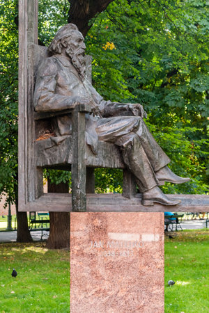 Krakow, Poland - July 27, 2019: View of sitting Jan Matejko sculpture at Planty Park in Krakow. Jan Alojzy Matejko was a Polish famous painter.のeditorial素材