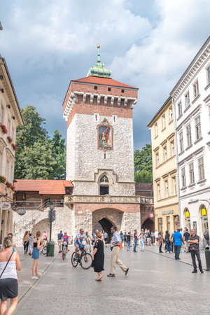Krakow, Poland - July 27, 2019: Tourists near St. Florian's Gate (Florian Gate) in Krakow. Gate named after St. Florian became the main entryway to the Old Town.のeditorial素材