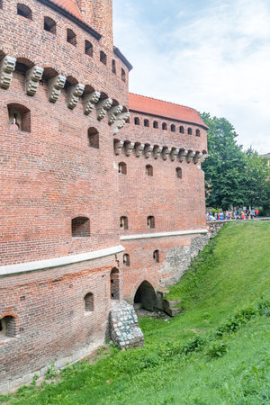 Krakow, Poland - July 27, 2019: Moat of Cracow Barbican (Polish: Barbakan Krakowski).のeditorial素材