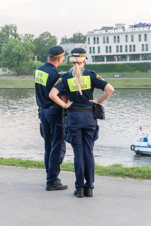 Krakow, Poland - July 27, 2019: Polish Municipal Police (Straz Miejska) in Krakow city.のeditorial素材