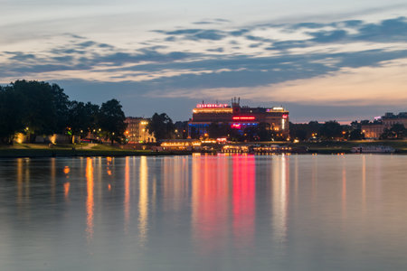 Krakow, Poland - July 27, 2019: Vistula River with Jubilat shopping mall in the evening.のeditorial素材