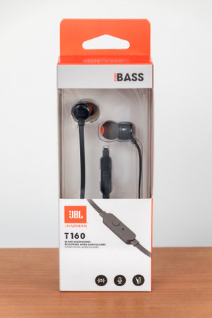Pruszcz Gdanski, Poland - August 1, 2019: JBL by Harman T160 in-ear headphones with microphone.のeditorial素材