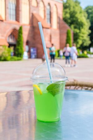 Green alcohol free mojito in plastic cup.の写真素材