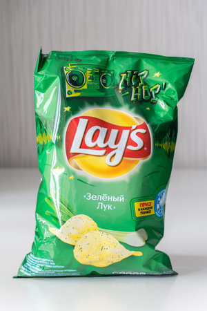 Kaliningrad, Russia - August 4, 2019: Pack of Lay's chips with a green onion flavor.のeditorial素材