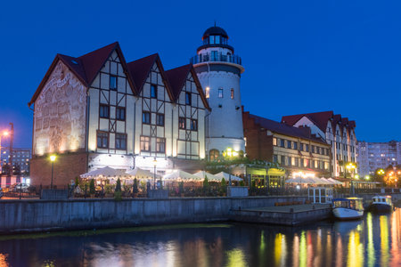 Kaliningrad, Russia - August 5, 2019: Buildings of the Fishing Village at night.のeditorial素材