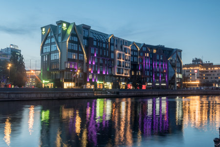 Kaliningrad, Russia - August 5, 2019: Holiday Inn hotel in Kaliningrad at night. Holiday Inn is American hotel chain is owned by InterContinental Hotels Group.のeditorial素材