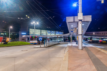 Ostrava, Czech Republic - August 29, 2019: Night view of bus and tram stop at Ostrava hlavni nadrazi railway station.のeditorial素材