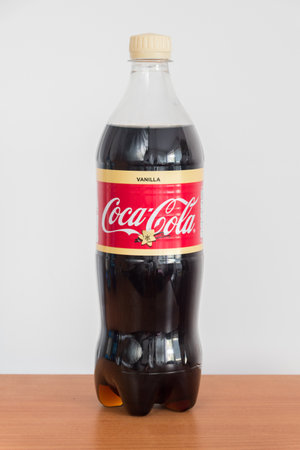 Pruszcz Gdanski, Poland - August 7, 2019: Bottle of Vanilla Coca-Cola drinks on wooden table. Coca-Cola drinks are produced and manufactured by The Coca-Cola Company.のeditorial素材