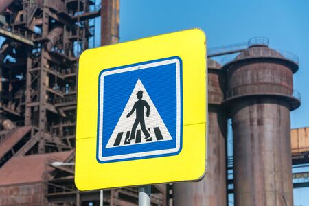 Pedestrian crossing road sign at a crosswalk.の写真素材