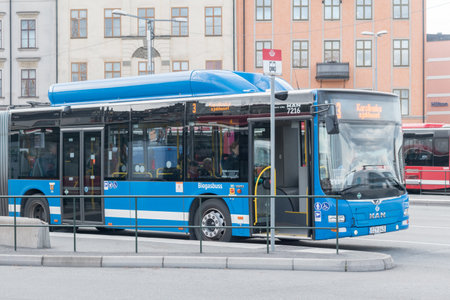 Stockholm, Sweden - September 24, 2019: Blue bus on bus stop in Stockholm.のeditorial素材