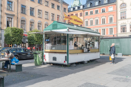 Stockholm, Sweden - September 24, 2019: Nystekt Stromming food booth with fish.のeditorial素材
