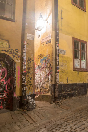 Stockholm, Sweden - September 24, 2019: Entrance to Marten Trotzigs Grand alley at night. Marten Trotzigs Grand is the narrowest street in the city, 90 cm wide.のeditorial素材
