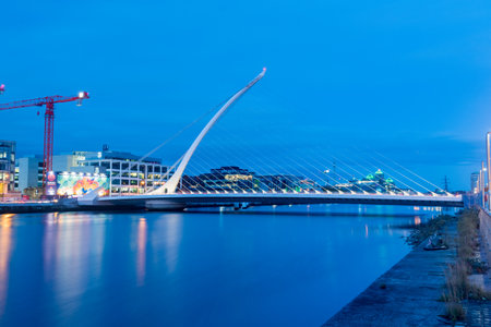 Dublin, Ireland - November 5, 2019: Docklands and Samuel Beckett bridge at nightのeditorial素材