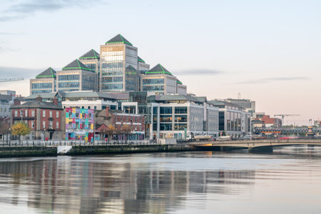 Dublin, Ireland - November 5, 2019: Liffey river with George's Quay Plaza is the headquarters of Ulster Bank.のeditorial素材