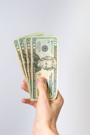 20 dollar bills held in hand.の写真素材