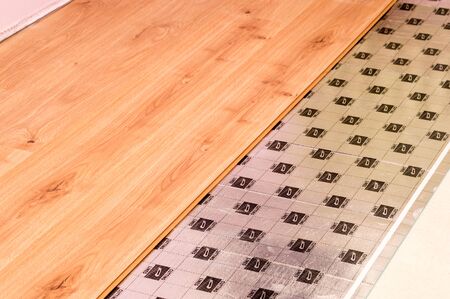 Close-up of floor panels and primer during room renovation.の写真素材