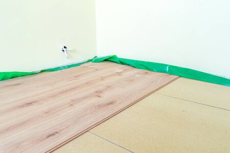 Laying floor panels on chipboard sleepers.の写真素材
