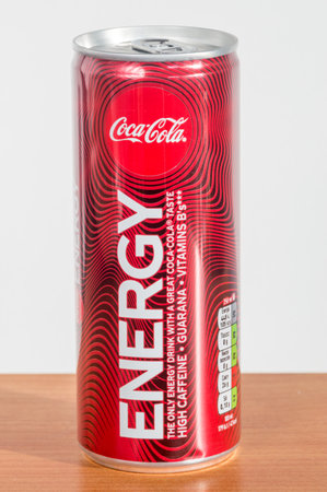 Pruszcz Gdanski, Poland - February 16, 2020: Can of Coca-Cola Energy drink on wooden table.のeditorial素材