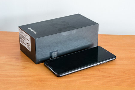 Pruszcz Gdanski, Poland - April 13, 2020: Box and Samsung S20 Ultra 5G (SM-G988B/DS) on wooden table.のeditorial素材